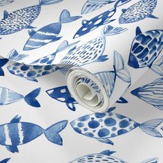 a blue and white wallpaper with fish on it