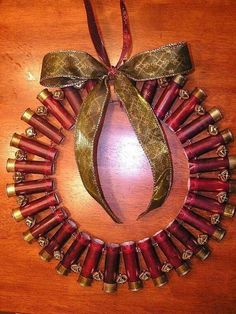 an ornament made out of wine corks with a bow on it's neck