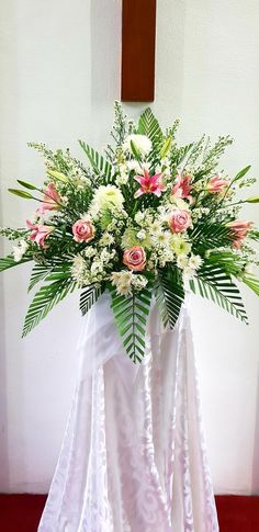 a bouquet of flowers is on display in front of the alter at st mary's church