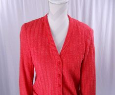 "Vintage 1970's cardigan by Butte. Colors are white and a hot pinkish red. There are no size or material labels. Buttons up the front. Has pockets on the left and right lower sides on the front. Long sleeve. Has some shoulder padding. Measurements while buttoned and laying flat are: 15.25\" shoulder seam to shoulder seam Bust: 18.5\" armpit to armpit Length: 25.25\" from top center of back of neck to bottom of cardigan Sleeve: 22.75\" from shoulder seam to end of sleeve" 1970s Blouse, 70s Skirt, 80s Shirts, Seventies Fashion, Pinkish Red, Jumpers And Cardigans, Left And Right, Cardigans For Women, Knit Cardigan