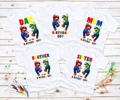 three t - shirts with mario and luigi on them, one is for the birthday boy