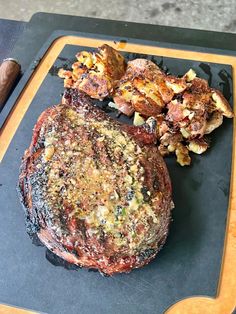 the steak is ready to be grilled on the grill, and served with potatoes