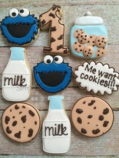 cookies decorated to look like sesame the cookie monster, milk bottle and cookies with words that say me want cookies