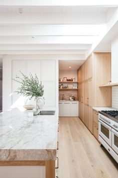 a kitchen with an oven, stove and counter top in it's center island