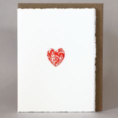 a card with a red heart drawn on it