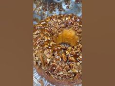 a bundt cake with pecans and caramel on top