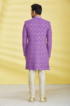 Purple georgette button down sequin work sherwani with patch pocket. Comes with a poly silk straight gold pants.
Component: 2
Pattern: Embroidered 
Type Of Work: Sequin 
Neckline: Mandarin 
Sleeve Type: Full
Fabric: Polly Silk,Georgette 
Color: Purple
Other Details: 
Embroidered buttons
Note: Pocket square worn by the model is not for sale
Occasion: Cocktail and Reception,Sangeet  - Aza Fashions Formal Sherwani With Gota Work For Diwali, Diwali Formal Sherwani With Gota Work, Bandhgala With Gota Work For Diwali Reception, Bandhgala For Reception With Gota Work For Diwali, Diwali Reception Bandhgala With Gota Work, Designer Semi-stitched Sherwani With Gota Work, Formal Sherwani With Gota Work For Eid, Bollywood Style Formal Traditional Wear With Gota Work, Formal Bollywood Traditional Wear With Gota Work