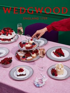 a table topped with lots of cakes and desserts