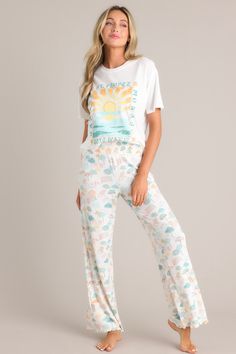 Stay stylish while lounging on vacation with our Z-Supply Dawn Umbrella White Shell Pants. These beach umbrellas-inspired lounge pants are perfect for your next vacation. Keep cool and comfy in these trendy pants. Now that's what we call a "shell" of a good time!  These pants feature a high waisted design, a fully smocked waistband, a super soft material, a wide leg, and a scalloped hemline.   52% Rayon, 44% Polyester, 4% Spandex Machine Wash Cold Unlined Manufactured in China Designed in the USA Model is wearing a size x-small Sunset Graphic, Sorority Rush Dresses, Preppy Girls, Trendy Pants, Beachy Vibes, Rush Dresses, Cardigan Crop Top, China Design, Cardigan Crop