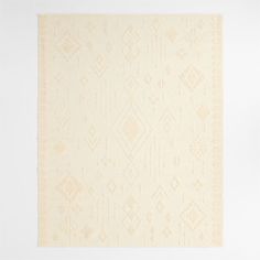 a beige and white rug with an intricate design