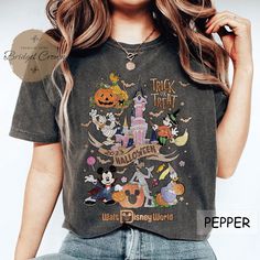 Disney Halloween Shirt, Trick Or Treat Shirt, Mickey And Friends Halloween Shirt Themed Black Cotton Tops, Black Cotton Themed Tops, Fall Themed T-shirt With Letter Print, Themed Short Sleeve Fall Top, Themed Short Sleeve Top For Fall, Themed Black Tops With Cartoon Print, Black Character Print Top For Fall, Black Themed Long Sleeve T-shirt, Black Cartoon Print Themed Tops