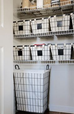 an organized closet with baskets and bins