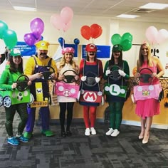 group of people dressed up in costumes and holding their cell phones at an office party