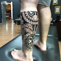 a man with a tattoo on his leg