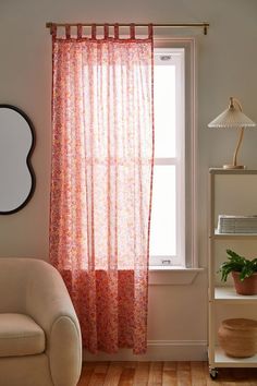 a living room with a chair and window