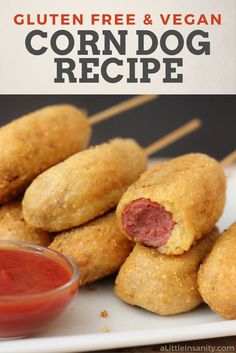 corn dog recipe on a white plate with ketchup and dipping sauce in the background