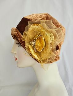 ONE OF A KIND!     ~size small 21.5" Charming 1920's flapper cloche with fabulous big flower! Lustrous bronze silk velvet of exquisite quality. Decorated with vintage silk and velvet flower with sparkly stamens in center. Flower has a bit of a shabby chic look to it that I love. Vintage floral rayon lining. HEAD SIZES AVAILABLE:  SMALL 21.5" Ships Priority 2-3 day delivery in US. Gatsby Style Cloche Hat For Kentucky Derby, Vintage Gold Hat With Short Brim, Gold Vintage Hats For Vintage Events, Vintage Gold Hat For Kentucky Derby, Adjustable Gold Cloche Hat, Flapper-style Brimmed Cloche Hat For Party, Flapper Style Brimmed Cloche Hat For Parties, Party Flapper Brimmed Cloche Hat, Flapper Party Cloche Hat With Brim