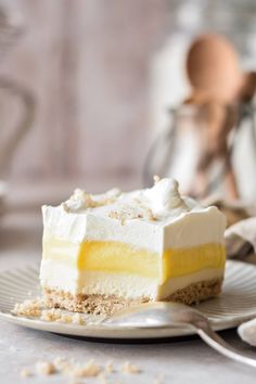 a piece of cake sitting on top of a plate next to a fork and spoon