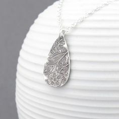 A bohemian style handmade Sterling Silver teardrop, textured with my Enchanted Garden pattern, is one inch in length and suspended from a delicate 1.9mm Sterling Silver cable chain. The teardrop has been antiqued to a dark black, buffed and tumbled polished and the chain is shiny silver. Please note that the texture on each teardrop will vary slightly as each one is created one at a time by my own two hands. Sterling Silver Teardrop: 1 inch Chain Length: Please choose at checkout. Matching earri Bohemian Sterling Silver Pendant Drop Necklace, Bohemian Long Drop Necklace As Gift, Bohemian Etched Teardrop Jewelry, Bohemian Sterling Silver Teardrop Pendant Necklace, Bohemian Teardrop Sterling Silver Drop Necklace, Handmade Long Drop Necklace As Gift, Bohemian Teardrop Pendant Drop Necklace Gift, Handmade Long Drop Necklace Gift, Handmade Long Drop Necklace For Gift