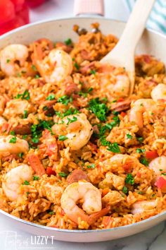 a skillet filled with shrimp and rice