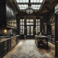 a large kitchen with wooden floors and black walls, along with an ornate chandelier that hung from the ceiling