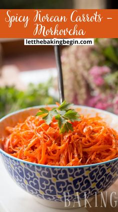 a blue and white bowl filled with shredded carrots