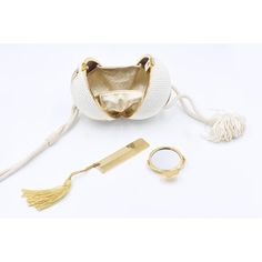 RARE Judith Leiber white crystal sphere minaudières shoulder bag in excellent vintage condition. White Swarovski crystal exterior trimmed with gold edges and clear crystals along top and side design. Corded Silk shoulder strap with tassel detail. Front button closure opens to a gold leather interior that holds signature mini pocket comb and mirror. Great condition.  Perfect for collectors and fashion lovers alike. This is a very rare Judith Leiber minaudiere that is perfect for any special occas Gold Disco Ball, Pocket Comb, Bag With Tassel, Side Design, Couture Bags, Judith Leiber, Exterior Trim, Clear Crystals, Crystal Sphere