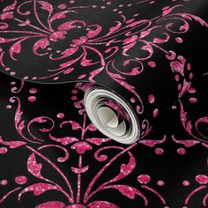 a black and pink wallpaper with an intricate design on the bottom half of it