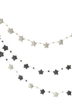 black and white stars are hanging from a string