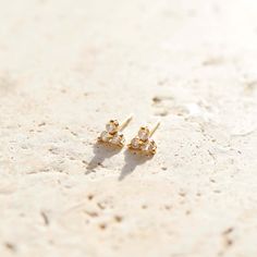 Lily Studs offer a perfect balance of delicate style and subtle sparkle. Crafted from high 18K gold filled and high quality CZs for a timeless look, these mini flower stud earrings will add a finishing touch to any outfit. * 5mm x 5mm Dainty Cubic Zirconia Cluster Earrings, Dainty 14k Gold Cluster Earrings, Dainty Gold Cluster Earrings, Flower Stud Earrings, Flower Stud, Flower Earrings Studs, Flower Studs, Gold Filled, 18k Gold