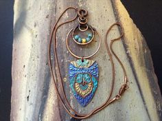 Beautiful copper component with patina colors in purple, blue and yellow.  It's is striking!  The copper pendant that the "badge" is hung from has Czech beads woven into it.    The pendant is hung on a copper chain with a lobster claw clasp.  Necklace measures approximately 18 inches.   The pendent is 3 1/2 inches long. Thank you! Patina Color, Clasp Necklace, Copper Pendant, Copper Chain, Copper Pendants, Czech Beads, Blue And Yellow, Bead Weaving, Bead Necklace