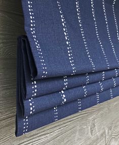 four pieces of blue fabric with white dots on them