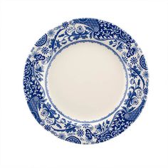 a blue and white plate with an ornate design on the rim, against a white background