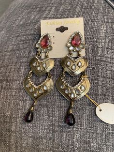 Huge Gothic Amethyst Teardrop Waterfall Chandelier Dangles, Etruscan 90s Glamour Jewelry Statement Earrings, Goldtone with Mauve & Clear Rhinestones 4 and inches long! Unworn Old Stock on Original Card! I recently found these beautiful high end earrings (and a few others) in the back room of a wonderful 40+ year old store in NYC's Costume Jewelry Store! Very exciting day! Vintage Fashion Glamour Jewelry In excellent collected vintage condition Arrives polished & gifted nicely 🎀 www.MySo Silver Jeweled Dangle Earrings, Party Chandelier Earrings With Stone Work, Vintage Teardrop Chandelier Earrings For Party, Jeweled Teardrop Metal Earrings, Party Jeweled Dangle Teardrop Earrings, Jeweled Dangle Teardrop Earrings For Party, Party Jeweled Teardrop Dangle Earrings, Festive Costume Jewelry Metal Earrings, Festive Metal Costume Jewelry Earrings