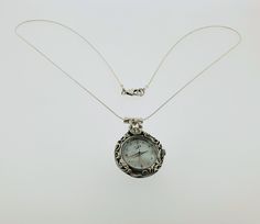 "From PORANS collection ---> 925 sterling silver round engraved watch pendant necklace with 1 M.O.P stone for women gift Pendant watch dimensions: Max length: 40 mm Width: 28 mm The length of the chain is usually 24\" - 26\", yet can be made at any size you wish, if you are interested in a specific length, Please! write a note on check out Our watch is top quality stainless still, analog, Japanese movement with water resistance (up to 3 atmospheres) and it is powered by a battery that lasts a Timeless Silver Jewelry Gift, Timeless Silver Jewelry For Gift, Timeless Silver Necklace Gift, Timeless Silver Necklace For Gift, Elegant Pocket Watch As Gift, Timeless Silver Snake Chain Jewelry, Timeless Silver Round Pendant Jewelry, Timeless Silver Necklace With Round Stone, Timeless Silver Jewelry With Round Stone