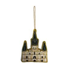 a christmas ornament with a castle on it