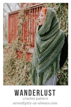 a woman wearing a green shawl with the words wanderlust written on it