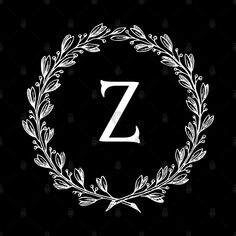 the letter z surrounded by a wreath of leaves