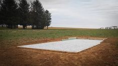 a concrete slab in the middle of a field