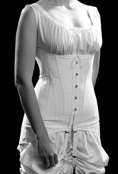 "What would you wear under your sleek and glittering Erte' gown? Or as the gorgeously gowned Kate Winslet in her role as Rose in \"Titantic\", or perhaps to visit Downton Abbey? Why an Edith c. 1912 corset of course! It will slenderize you from bum to underbust keeping everything in check. No extreme nipping in of the waist with this corset. It leaves that duty to other eras. Long and lean that's the idea; enhancing those long slender lines of the early part of the 20th century. You'll need your Elegant Costume Corset With Boning, Elegant Boned Corset For Costume, Elegant Boning Corset For Costume, Classic Fitted Corset With Boning, Elegant Corset With Boning For Costume Party, Elegant Corset Belt For Costumes, Elegant Corset Dress With Boning For Costume, Elegant Wedding Corset Belt With Boning, Edwardian Corsets