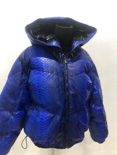 Snakeskin DUCK DOWN Jacket for women. A jacket made from genuine python leather. Removable hood. Outside: GENUINE PYTHON LEATHER Inside: DUCK DOWN 100% Accessories: silver color (please see the photo). Lining: MONCLER All our products are 100% handmade, we always try to create interesting ideas to make your style unique. We use only the highest quality materials and accessories from around the world and only best leather from Indonesia. Before listing each new model undergoes different quality a Luxury Hooded Puffer Jacket With Zipper Closure, Luxury Blue Puffer Jacket For Winter, Luxury Blue Winter Puffer Jacket, Luxury Blue Puffer Jacket, Luxury Puffer Jacket With Double-lined Hood, Luxury Hooded Jacket With Padded Collar, Summer Color Trends, Snake Skin Bag, Best Leather