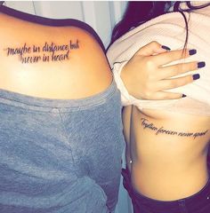 two women with tattoos on their stomachs and one has the words, maybe but never in