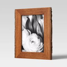 black and white flowers in a wooden frame