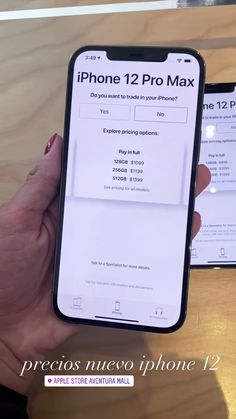 the iphone 12 pro max is being held up by someone's hand with their phone number on it