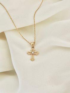 "This is a 14k yellow solid gold (not filled or plated) hollow cross necklace furnished with a tiny shiny cubic zirconia diamond. The necklace is easy to wear alone or layered with something else. This also makes the perfect gift. - 14K SOLID GOLD - WEIGHT: 2.10 gr - Necklace LENGTH: 19 3/4\" - PENDANT LENGTH: 7/8\" Each item comes in a beautiful gift box. HOW TO CARE FOR YOUR JEWELRY: + Unlike any gold-filled, plated, or vermeil jewelry that is not solid gold, wet areas, perfumes, and lotions w Diamond Cut Cross Necklace As Gift, Gift Cross Necklace With Diamond Cut, Gold Cross Jewelry With Birthstone, Gold Cross Birthstone Jewelry, Gold Diamond Cross Necklace Gift, Gold Diamond Cross Necklace As Gift, Gold Cross Necklace With Diamond Cut As Gift, Gold Diamond Cut Cross Necklace Gift, Gold Diamond Cut Cross Necklace As Gift