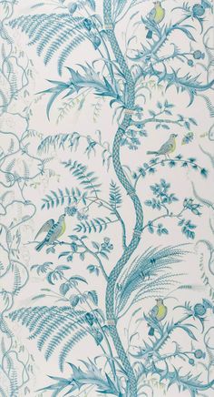 a blue and white wallpaper with birds in the tree on it's side