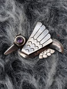 Bird Sterling silver (tested/stamped) Amethyst eye Pre Eagle Taxco Nice fastener Beautiful patina Label/Stamp: Mexico Silver early Taxco stamp 20210109J966 Condition: Beautiful condition. Nice patina, no rough edges. We've not polished, leaving that up to new owner. See pics. Sold as is. Measurements: 2.25 x 1.75inches (5.71 x 4.44cm) Materials: sterling silver, amethyst Provenance: mid-late1940s Care: polish with soft cloth, as desired. Check measurements and/or convo with ANY questions prior t Mid-century Silver Brooches For Collectors, Mid-century Silver Brooch For Collectors, Mid-century Silver Jewelry With Brooch, Black High Top Converse, Purple Sunglasses, Silver Bird, Bird Brooch, Silver Zipper, Rainbow Heart