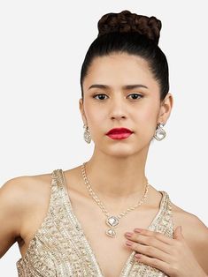 Add a touch of sophistication to your wardrobe with this stunning double-layered necklace and earring set. Featuring a radiant gold tone with dazzling Austrian diamonds and delicate bead embellishments, this set exudes elegance and luxury. Perfect for weddings, parties, or special occasions, it includes matching earrings for a complete and polished look. Elevate your style with this exquisite and versatile jewelry set. Versatile Jewelry, Necklace And Earring Set, Dress Jewelry, Layered Necklace, Ethnic Jewelry, Wedding Wear, Necklace Earring Set, Ring Bracelet, Earring Necklace