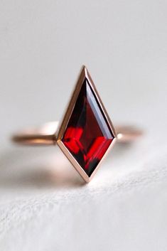 Elegant Red Garnet Stackable Rings, Elegant Red Stackable Promise Rings, Elegant Red Gemstone Stackable Rings, Timeless Red Ring With Polished Finish, Elegant Garnet Gemstone Stackable Rings, Elegant Red Stackable Rings With Bezel Setting, Elegant Stackable Garnet Gemstone Rings, Modern Red Ring For Formal Occasions, Modern Red Rings For Formal Occasions