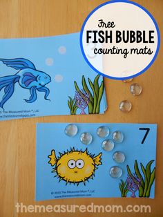 two fish bubble counting mats on a table